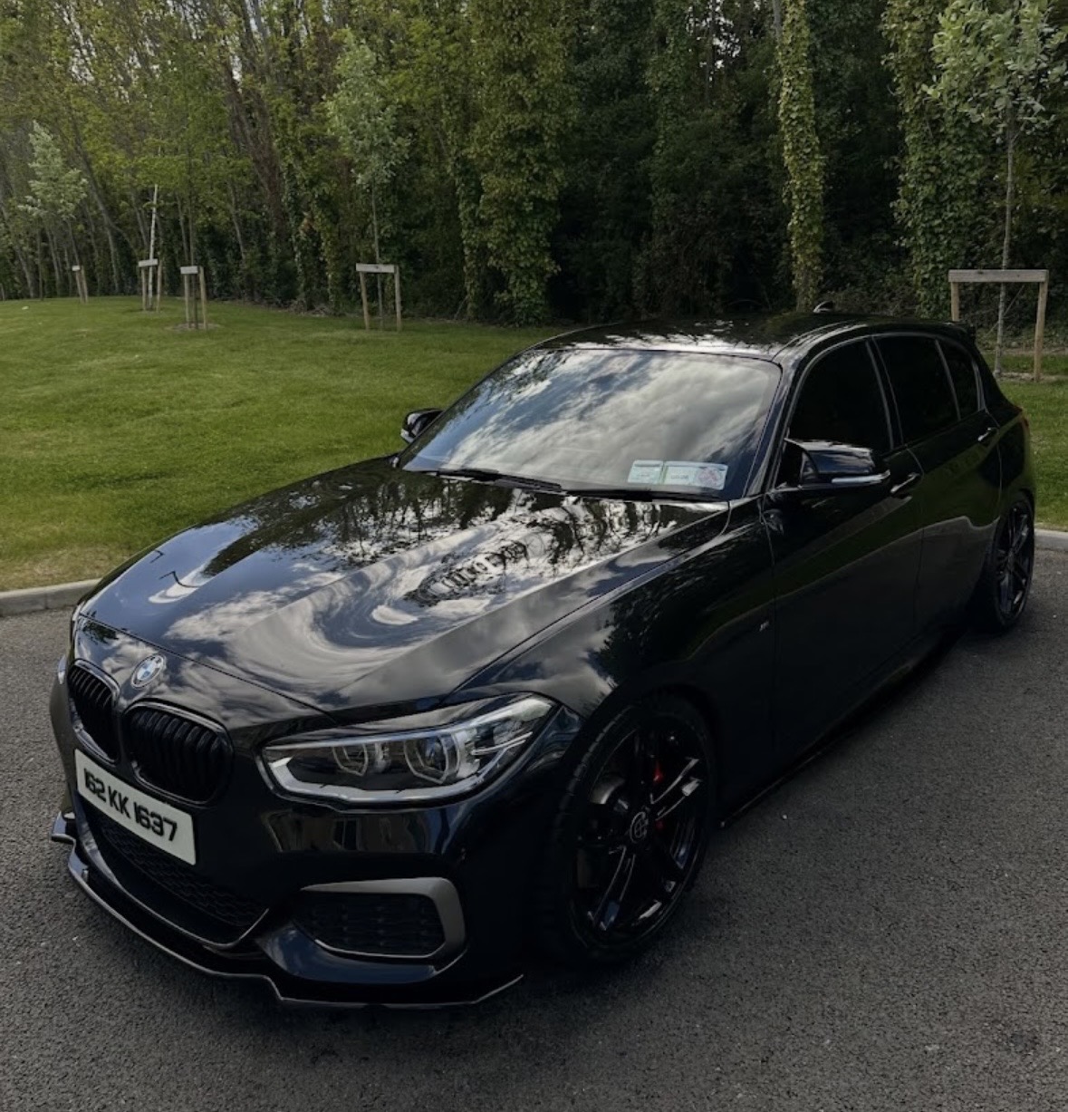 Black BMW M140i with mirror-gloss paintwork
