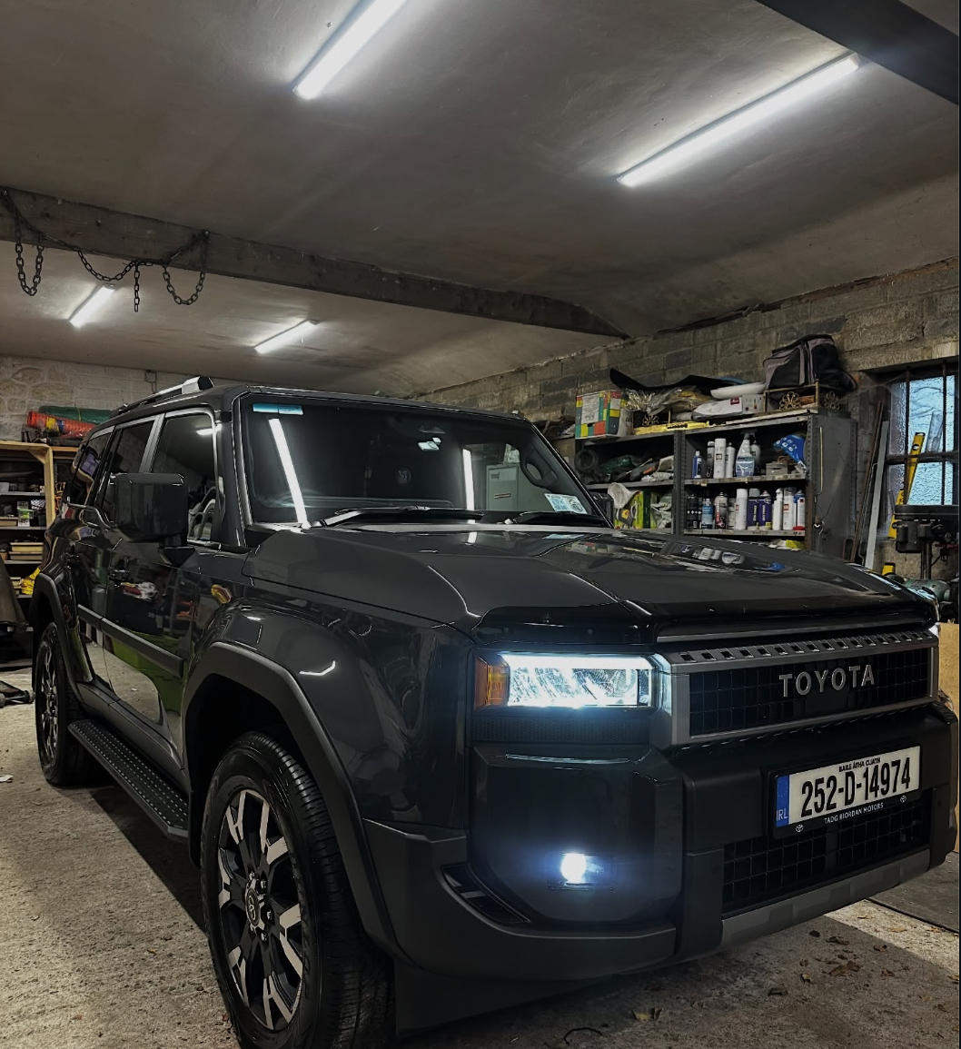 Black Toyota Land Cruiser detailed in the workshop